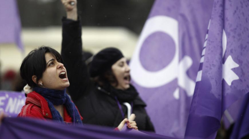 Women protest against the government and violence against women, a day after International Women's Day in Istanbul March 9, 2014. On March 8 activists around the globe celebrate International Women's Day, which dates back to the beginning of the 20th Century and has been observed by the United Nations since 1975. The UN writes that it is an occasion to commemorate achievements in women's rights and to call for further change. REUTERS/Osman Orsal (TURKEY - Tags: POLITICS CIVIL UNREST) - RTR3GB8T