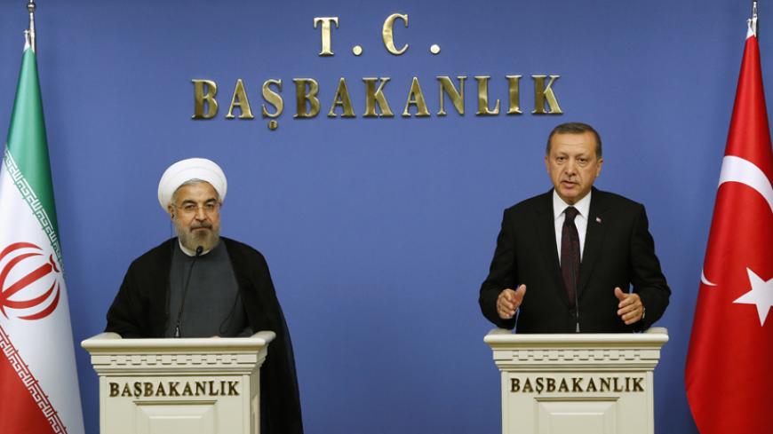 Iran's President Hassan Rouhani and Turkish Prime Minister Tayyip Erdogan attend a news conference in Ankara June 9, 2014. REUTERS/Umit Bektas (TURKEY - Tags: POLITICS) - RTR3SXIL
