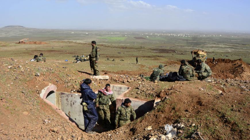 Fighters loyal to Syria's President Bashar Al-Assad rest on a hill after regaining control of Tal Fatima, a town south of Damascus, in the Daraa countryside March 1, 2015. Government forces say they've regained control of this and many other villages in the south - wresting them back from rebel hands.A general made the announcement on state television, saying a large number of Nusra Front fighters were killed and their weapons destroyed. The gains were said to happen on Friday and Saturday in a large offens