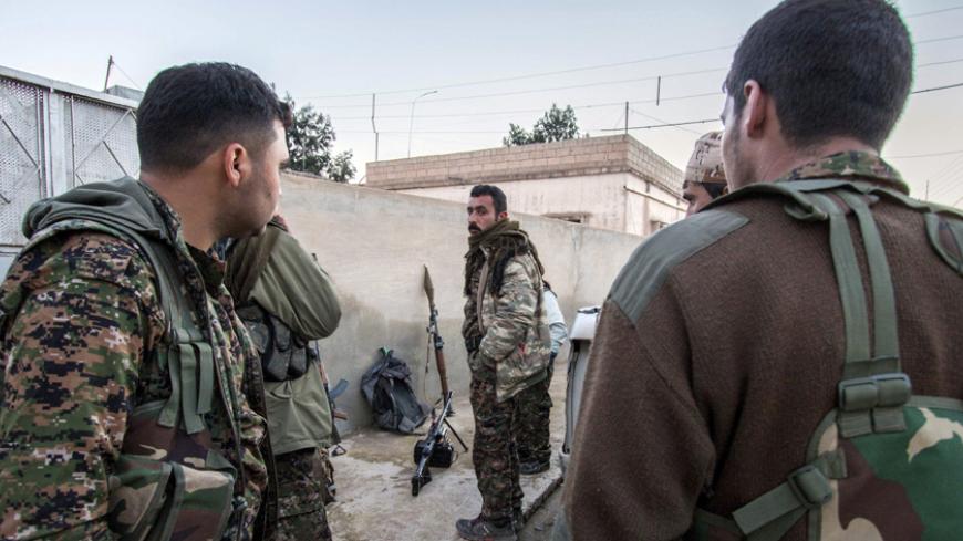 Kurdish People's Protection Units (YPG) fighters gather with their weapons in the Assyrian village of Tel Jumaa, north of Tel Tamr town March 4, 2015. The Kurdish People's Protection Units (YPG) have seized two towns and dozens of villages from Islamic State (IS) in an offensive that got under way on Feb. 21 in the strategically important Hasaka province that borders IS-held areas in Iraq. Picture taken March 4, 2015. REUTERS/Rodi Said (SYRIA - Tags: POLITICS CIVIL UNREST CONFLICT) - RTR4S816