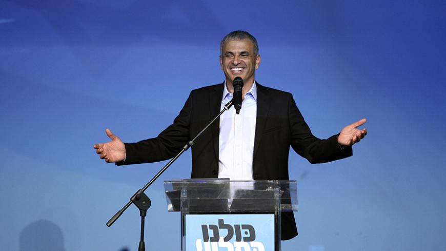 Moshe Kahlon (C), head of the new centrist party Kulanu (All of Us), addresses supporters at party headquarters in Tel Aviv March 18, 2015. Prime Minister Benjamin Netanyahu claimed victory in Israel's election on Tuesday after exit polls showed he had erased his center-left rivals' lead with a hard rightward shift that saw him disavow a commitment to negotiate a Palestinian state. A new centrist party led by former communications minister Kahlon could be the kingmaker in coalition talks. REUTERS/Stringer