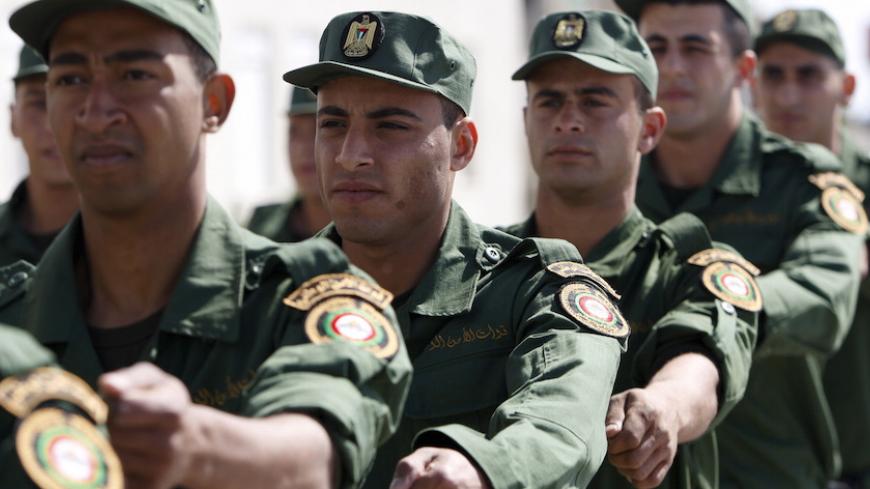 Members of Palestinian National Security Forces march during a military exercise in the West Bank city of Jericho March 20, 2015. REUTERS/Mussa Qawasma - RTR4U809