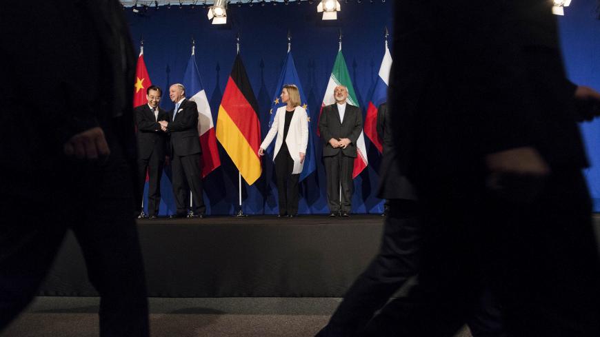 (L-R) Chinese Ambassador to the United Nations Wu Hailong, French Foreign Minister Laurent Fabius, European Union High Representative Federica Mogherini and Iranian Foreign Minister Javad Zarifat arrive to deliver statements following nuclear talks at the Swiss Federal Institute of Technology in Lausanne (Ecole Polytechnique Federale De Lausanne) April 2, 2015. Iran and world powers reached a framework on curbing Iran's nuclear programme at marathon talks in Switzerland on Thursday that will allow further n