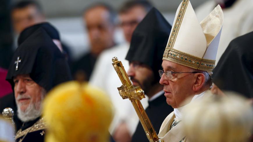 Pope Francis (R) arrives to leads a mass on 100th anniversary of the Armenian mass killings in St. Peter's Basilica at the Vatican April 12, 2015. Pope Francis on Sunday commemorated the 100th anniversary of the massacre of as many as 1.5 million Armenians as "the first genocide of the 20th century," words that could draw an angry reaction from Turkey. REUTERS/Tony Gentile - RTR4WZ03