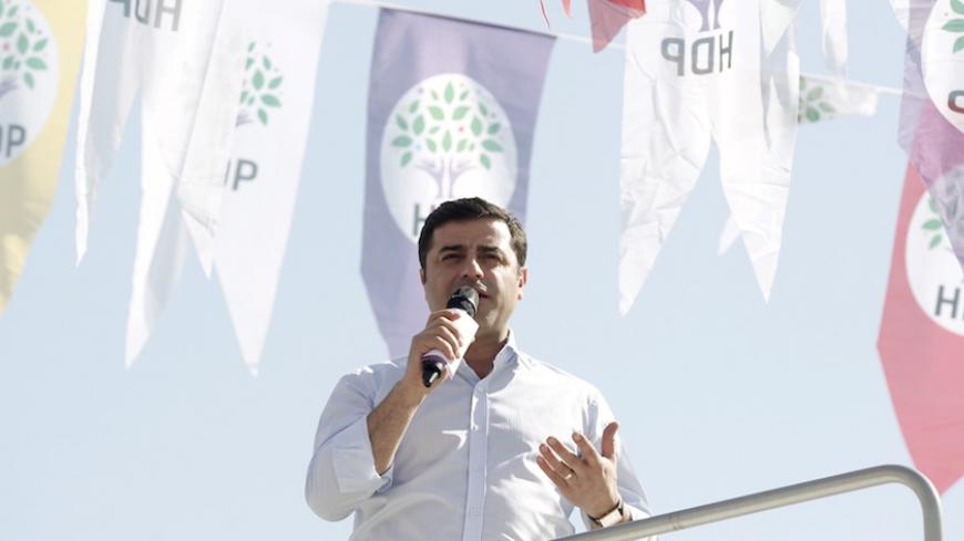 Selahattin Demirtas, co-chairman of the pro-Kurdish Peoples' Democracy Party (HDP), greets his supporters during an election rally for Turkey's June 7 parliamentary elections in Istanbul April 12, 2015. REUTERS/Osman Orsal - RTR4X0EJ