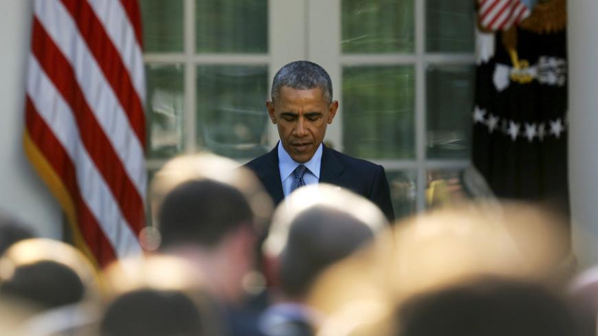 U.S. President Barack Obama pauses during remarks at a reception for supporters of H.R. 2, the Medicare Access and CHIP Reauthorization Act of 2015 in the Rose Garden at the White House in Washington April 21, 2015.  REUTERS/Jonathan Ernst - RTX19Q1Z