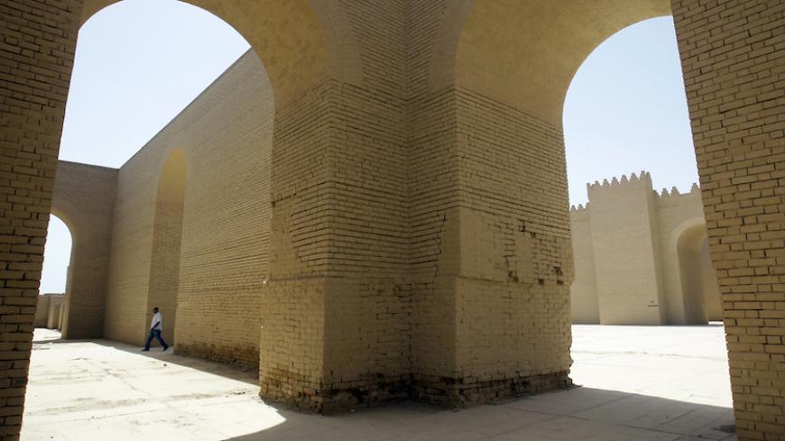 TO GO WITH AFP STORY BY SALAM FARAJ
An Iraqi man walks at the archaeological site of Babylon, south of Baghdad, on April 25, 2012. Babylon's Hanging Gardens were one of the Seven Wonders of the Ancient World, but heritage appears to be no match for Iraq's booming oil industry in a dispute over a new pipeline. AFP PHOTO / ALI AL-SAADI        (Photo credit should read ALI AL-SAADI/AFP/GettyImages)