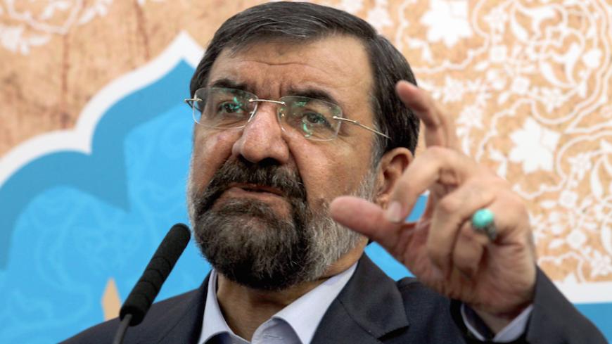 Iranian presidential candidate conservative former chief of the Revolutionary Guards Mohsen Rezai, speaks during a press conference at the old main bazaar of the capital Tehran, on May 28, 2013. Tehran last week excluded most would-be candidates from its June 14 elections, keeping only those loyal to the all-powerful supreme leader, dashing any hopes that a more moderate president would be voted into power.  AFP PHOTO/ATTA KENARE        (Photo credit should read ATTA KENARE/AFP/Getty Images)
