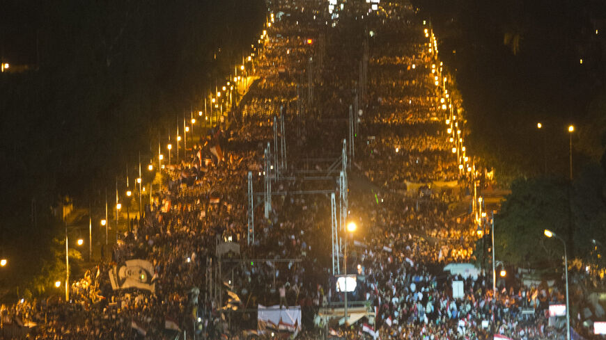 Egyptian demonstrators gather outside the presidential palace in Cairo during a protest calling for the ouster of President Mohamed Morsi on July 1, 2013. Egypt's armed forces warned that it will intervene if the people's demands are not met within 48 hours, after millions took to the streets to demand the president's resignation. AFP PHOTO / KHALED DESOUKI (Photo credit should read KHALED DESOUKI/AFP/Getty Images)