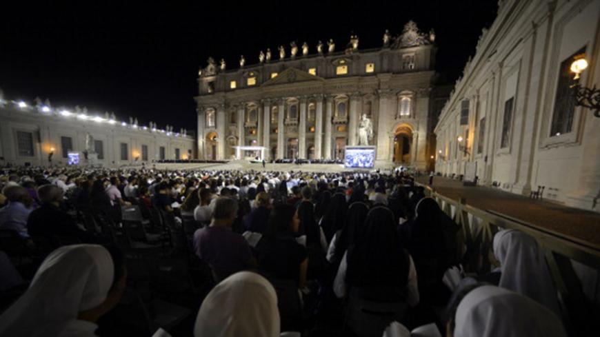 Nuns pray in Saint Peter square during a mass at the Vatican on September 7, 2013. The pope has called for a global day of fasting and prayer on Saturday for peace in Syria and against any armed intervention. AFP PHOTO / Filippo MONTEFORTE (Photo credit should read FILIPPO MONTEFORTE/AFP/Getty Images)