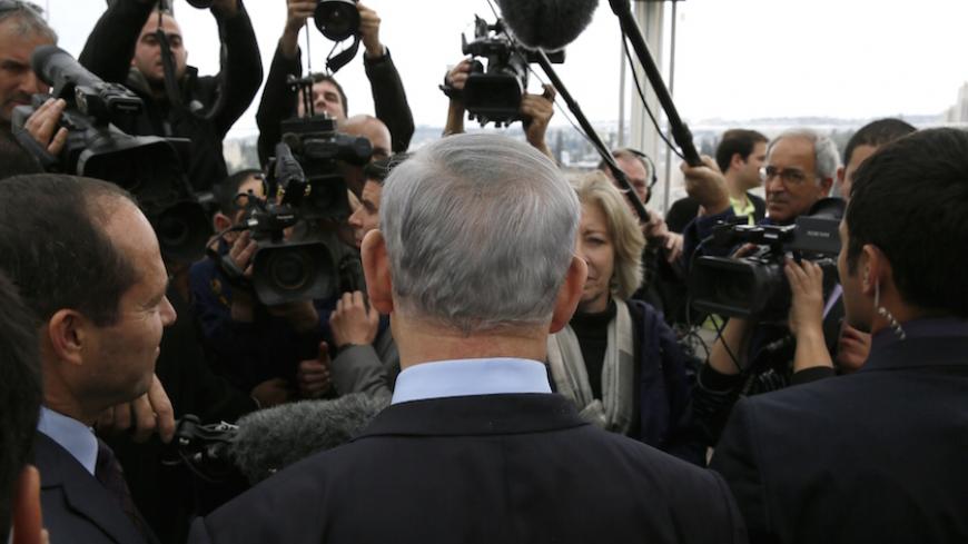 Israeli Prime Minister Benjamin Netanyahu (C) and Jerusalem's mayor Nir Barkat (L) talk to journalists during a joint press conference on February 23, 2015 in Jerusalem, a day after Barkat and his bodyguard apprehended a young Palestinian who stabbed an ultra-Orthodox Jew in Jerusalem. AFP PHOTO / GALI TIBBON (Photo credit should read GALI TIBBON/AFP/Getty Images)