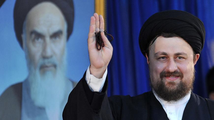 EDITORS' NOTE: Reuters and other foreign media are subject to Iranian restrictions on leaving the office to report, film or take pictures in Tehran. 

Hassan Khomeini, grandson of Iran's late leader Ayatollah Ruhollah Khomeini, waves as he speaks at a ceremony to mark the death anniversary of the Islamic Republic founder Ayatollah Khomeini at Khomeini's shrine in southern Tehran June 4, 2010. REUTERS/IIPA/Sajjad Safari (IRAN - Tags: POLITICS ANNIVERSARY) - RTR2ER21