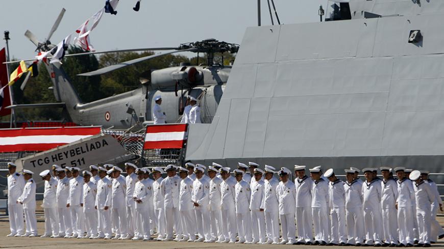 Navy officers attend a delivery ceremony for the first nationally designed combat ship TCG Heybeliada at the Tuzla Naval shipyard in Istanbul September 27, 2011.  REUTERS/Osman Orsal (TURKEY - Tags: POLITICS MILITARY) - RTR2RWMP