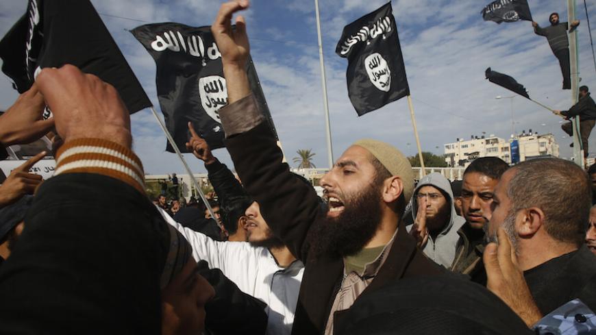 Palestinian Salafists shout during a protest against satirical French weekly magazine Charlie Hebdo's cartoons of the Prophet Mohammad, outside the French Cultural Centre in Gaza city January 19, 2015. Dozens of Jihadist Salafi men rallied in Gaza on Monday to condemn continued publication by French satirical magazine Charlie Hebdo of cartoons deemed offensive to Islam's Prophet. Charlie Hebdo published a picture of Mohammad weeping on its cover last week after gunmen stormed its offices in Paris, killing 1