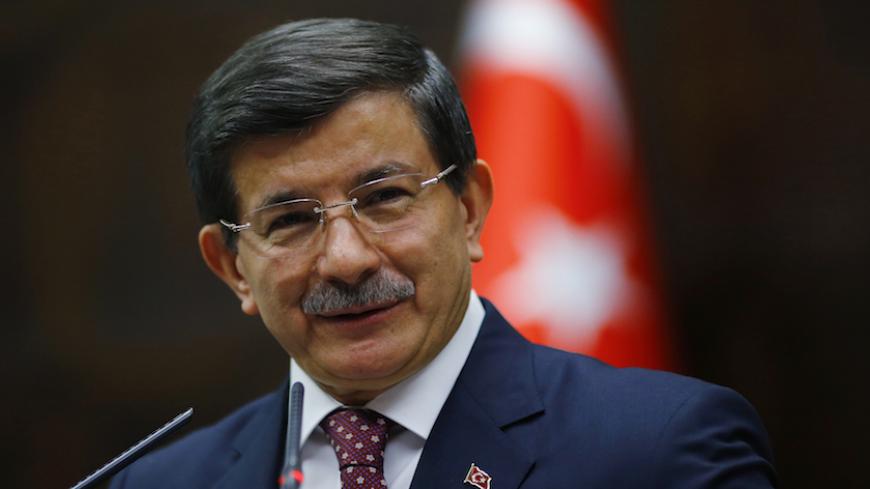 Turkey's Prime Minister Ahmet Davutoglu addresses members of parliament from his ruling AK Party (AKP) during a meeting at the Turkish parliament in Ankara March 2, 2015. REUTERS/Umit Bektas (TURKEY - Tags: POLITICS) - RTR4RQ8X