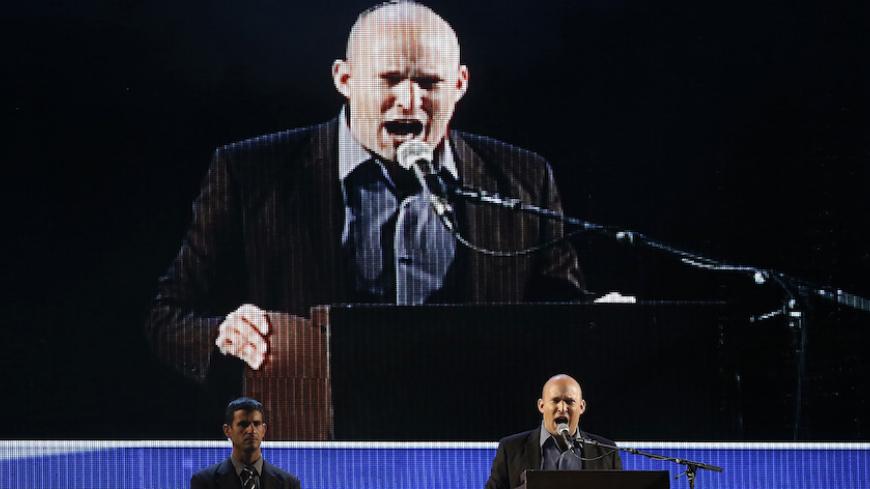 Israel's Economy Minister Naftali Bennett, head of far-right Jewish Home party, speaks during a right-wing rally in Tel Aviv's Rabin Square March 15, 2015. Israel's centre-left opposition is poised for an upset victory in the upcoming parliamentary election, with the last opinion polls before Tuesday's vote giving it a solid lead over Prime Minister Benjamin Netanyahu's party. REUTERS/Baz Ratner (ISRAEL - Tags: POLITICS ELECTIONS) - RTR4TGOG