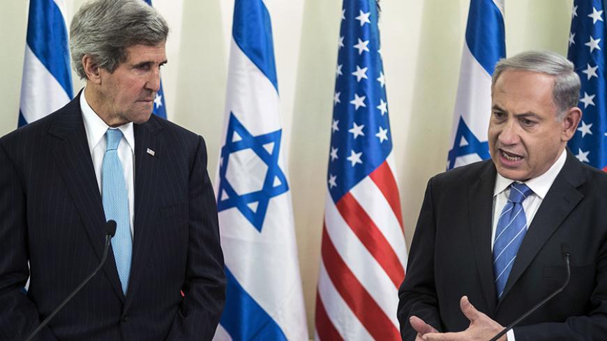 U.S. Secretary of State John Kerry listens as Israeli Prime Minister Benjamin Netanyahu makes a statement to the press before a meeting at the Prime Minister's Office in Jerusalem January 2, 2014. Kerry arrived in Israel on Thursday in his latest bid to resume peace negotiations and find scarce common ground between pessimistic Israeli and Palestinian officials. REUTERS/Brendan Smialowski/Pool (JERUSALEM - Tags: POLITICS) - RTX1702V