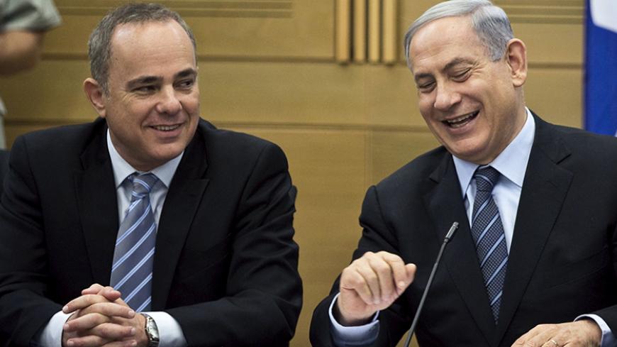 Israel's Prime Minister Benjamin Netanyahu (R) and Strategic Affairs Minister Yuval Steinitz attend a Likud party meeting at parliament in Jerusalem May 11, 2015. REUTERS/Ronen Zvulun - RTX1CG4C