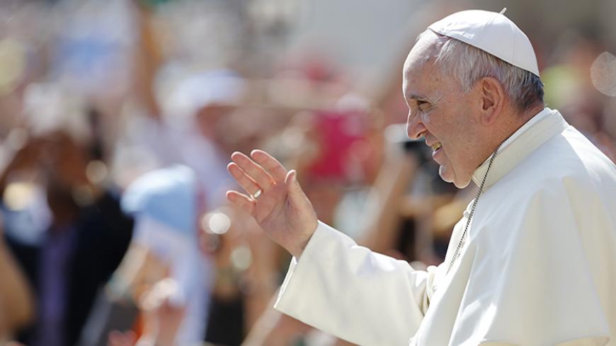 Pope Francis waves as he arrives to lead his weekly audience in St.Peter's square, at the Vatican City, May 13, 2015. REUTERS/Giampiero Sposito - RTX1CQI5