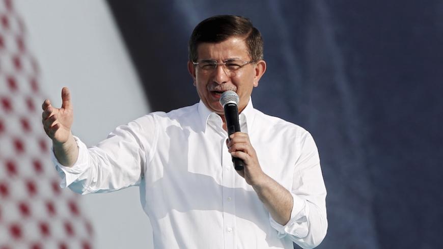 Turkish Prime Minister Ahmet Davutoglu addresses AK Party' supporters during an election rally for Turkey's June 7 parliamentary elections in Istanbul, Turkey, May 17, 2015. REUTERS/Osman Orsal - RTX1DC5K
