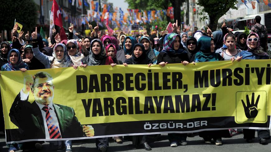 Pro-Islamist demonstrators hold a banner that reads "Coup leaders can't trial Mursi" during a protest in support former President Mohamed Mursi at the courtyard of Fatih mosque in Istanbul, Turkey, May 17, 2015. An Egyptian court on Saturday sought the death penalty for former president Mohamed Mursi and 106 supporters of his Muslim Brotherhood in connection with a mass jail break in 2011. Mursi and his fellow defendants, including top Brotherhood leader Mohamed Badie, were convicted for killing and kidnapp