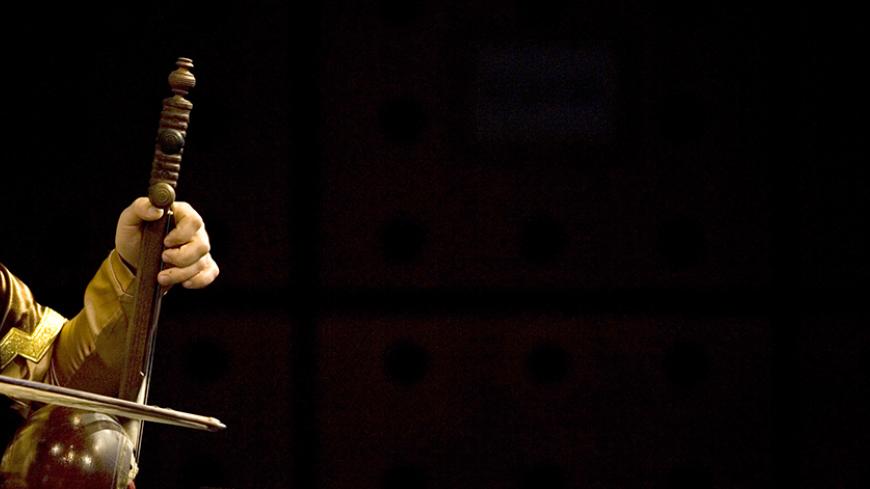 Musician Fariz Hosseinov from Azerbaijan plays a traditional musical instrument (Kamancheh) while performing at the 23rd Fadjr International Music Festival in a Cultural, Sport Commercial Complex in Tehran December 27, 2007. REUTERS/Morteza Nikoubazl (IRAN) - RTX51D1