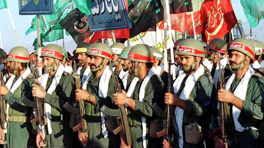 FILE PHOTO 2SEP98 - Iranian revolutionary guards lineup while participating in military manoeuvres held near the Afganistan border September 2. [Iran's Ground Forces commander Brigadier General Abdolali Pourshasb said September 12 in a news conference in Tehran "our policy is defensive. We do not intend to commit aggression against any country .... but we are ready to answer any move by the Taliban with a full power."  Pourshasb also said that Iran would hold a military exercise near Afghan border in late S