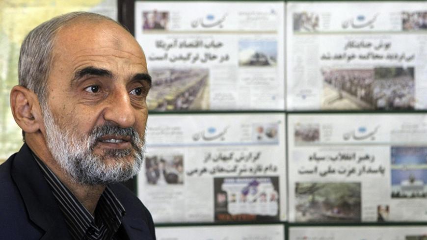 TO GO WITH AFP STORY BY STUART WILLIAMS 
Iranian Hossein Shariatmadari, director of the hardline Kayhan (Universe) newspaper group for the past 15 years, sits next issues of the newspaper at his office in Tehran, 16 September 2007. Ridiculing the latest US threats against Tehran and advocating the need to expose traitors, Shariatmadari remains one of the most ardent champions of Iran's Islamic system. Appointed by supreme leader Ayatollah Ali Khamenei himself, few in Iran can match Shariatmadari's authority