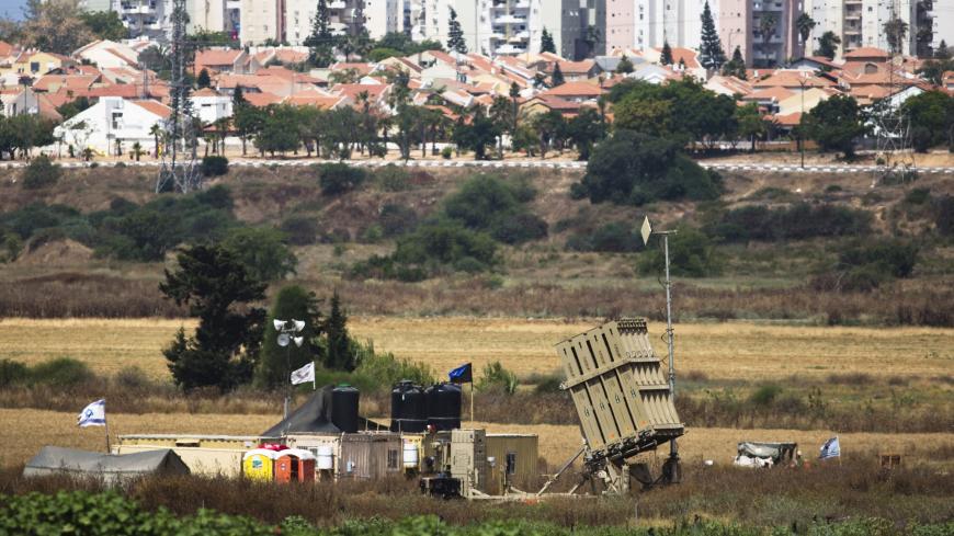 A recently located Iron Dome battary can be seen near the southern Israeli city of Ashkelon outside the Gaza Strip June 7, 2015. Israeli aircraft struck the Northern Gaza Strip on Sunday and Israel closed the border crossing with the Hamas-controlled territory after a rocket attack on Saturday claimed by the Omar Brigades, a Palestinian group that supports Islamic State. REUTERS/Amir Cohen - RTX1FHS4