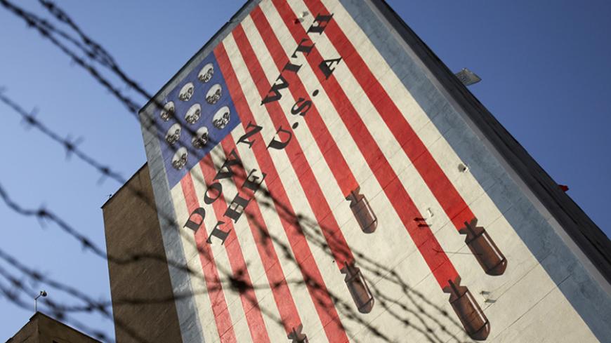EDITORS' NOTE: Reuters and other foreign media are subject to Iranian restrictions on leaving the office to report, film or take pictures in Tehran.

An anti-U.S. mural is seen on a wall of a government building in central Tehran October 12, 2011. U.S. authorities said on Tuesday that they had broken up a plot by two men linked to Iran's security agencies to kill the Saudi envoy, Adel al-Jubeir. One man was arrested last month while the other was believed to be in Iran. REUTERS/Morteza Nikoubazl (IRAN - Tag