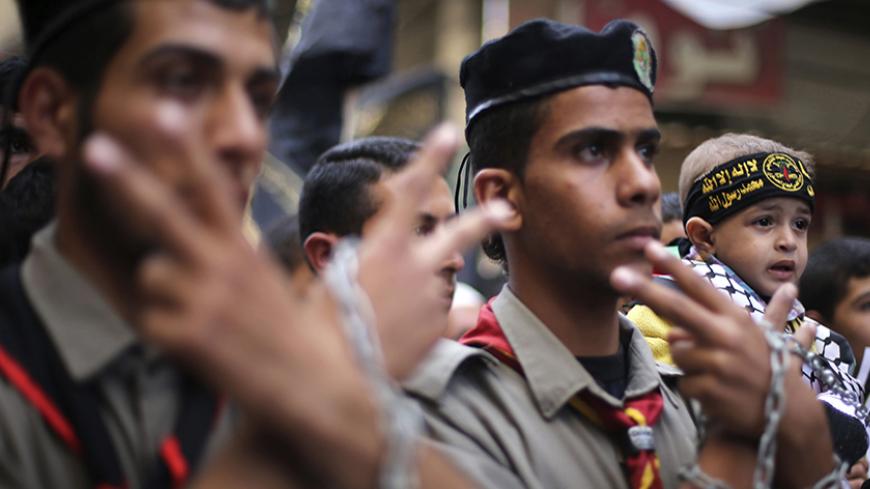 A Palestinian boy wearing an Islamic Jihad headband joins other Palestinians taking part in a protest against what they say are recent visits by Jewish activists to al-Aqsa mosque, in Khan Younis in the southern Gaza Strip November 7, 2014. In recent months, a campaign for the prayer ban on Jewish worshippers at the site, known to Muslims as the Noble Sanctuary and to Jews as Temple Mount, to be overturned, led by settler activists, has gathered momentum, raising alarm among Palestinians and Muslims further