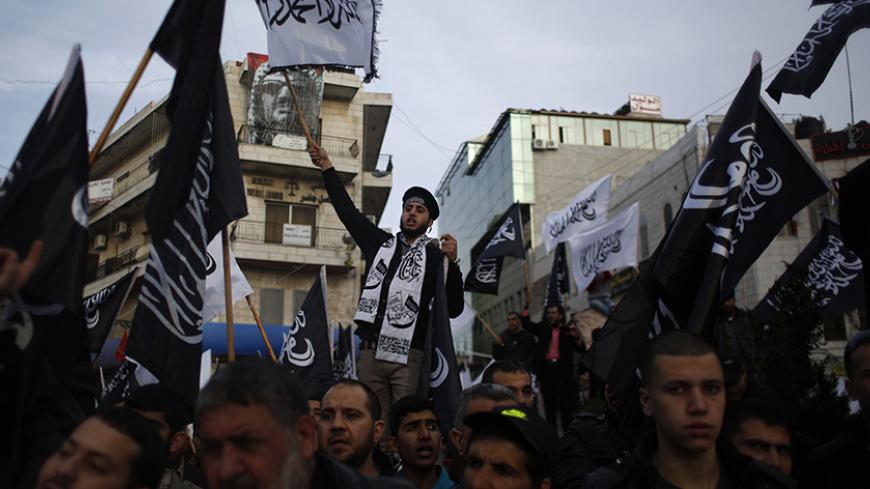 Palestinian supporters of Hizb ut-Tahrir take part in a protest against satirical French weekly newspaper Charlie Hebdo, which featured a cartoon of the Prophet Mohammad on the cover of its first edition since an attack by Islamist gunmen, in the West Bank city of Ramallah January 24, 2015. REUTERS/Mohamad Torokman (WEST BANK - Tags: POLITICS CIVIL UNREST RELIGION) - RTR4MQRG