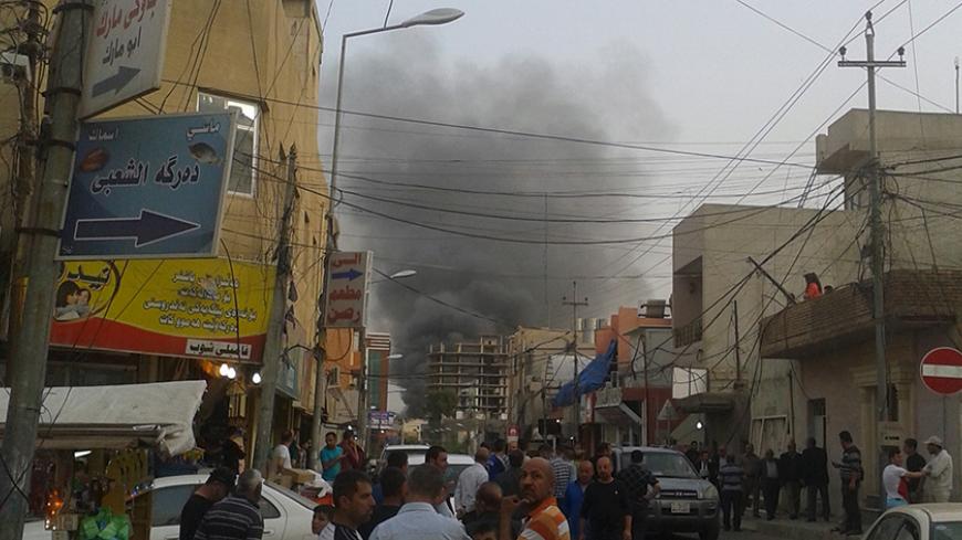 Smoke rises from the site of a bomb attack in Erbil, the capital of Iraq's Kurdistan region, April 17, 2015.  A car bomb exploded on a road outside the U.S. Consulate and compound in Erbil on Friday, a Reuters witness said. The consulate houses U.S. diplomats and staff but there was no immediate reports of casualties. Gunfire was heard immediately after the blast but stopped later, the witness said. REUTERS/Stringer - RTR4XRWU