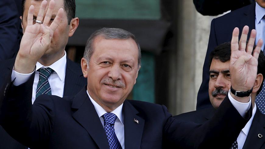Turkey's President Tayyip Erdogan greets his supporters in front of a mosque after Friday prayers in Istanbul, Turkey, May 29, 2015. Erdogan said the launch of Ziraat Bank's Islamic business should help to attract new funds to Turkey and urged other state lenders to help to triple Islamic banking's share of the market by 2023. Islamic finance has developed slowly in Turkey, the world's eighth most populous Muslim nation, partly because of political sensitivities and the secular nature of its laws. However, 