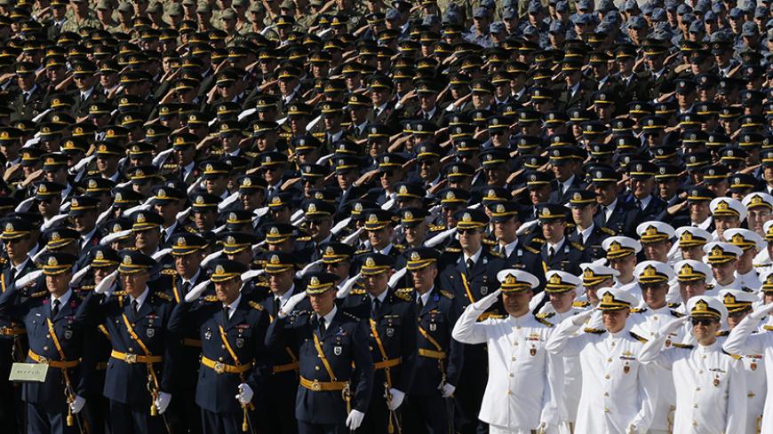 Turkish soldiers salute during a ceremony marking the 91st anniversary of Victory Day at the mausoleum of Mustafa Kemal Ataturk, founder of modern Turkey, in Ankara August 30, 2013. REUTERS/Umit Bektas (TURKEY - Tags: POLITICS MILITARY) - RTX131DP