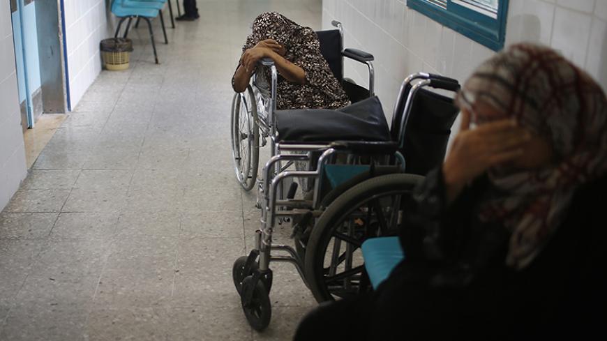 Palestinian patients wait to undergo kidney dialysis at al-Shifa hospital in Gaza City September 12, 2013. Cairo closed the Rafah crossing completely on Wednesday after assailants crashed two explosive-laden cars into a security building adjacent to the border zone, killing six Egyptian soldiers. Ashraf al-Qidra, spokesman for the Hamas-run Gaza Health Ministry, said 1,000 patients a month required medical care in Egypt and in other countries. Rafah's closure, he said, would also affect the import of medica