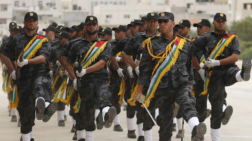 Members of Palestinian security forces loyal to Hamas march during a military graduation ceremony in Gaza City May 21, 2015. REUTERS/Suhaib Salem



 - RTX1DX3L