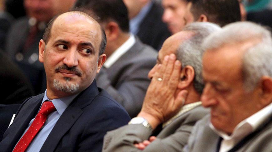 Former Syrian Coalition head Ahmad al-Jarba (L) attends the opening session of a Syrian opposition conference, in Cairo, Egypt June 8, 2015. Syrian opposition members are meeting with Egyptian officials in Cairo to discuss the ongoing crisis in Syria and the need for a united opposition.  REUTERS/Mohamed Abd El Ghany - RTX1FN3W