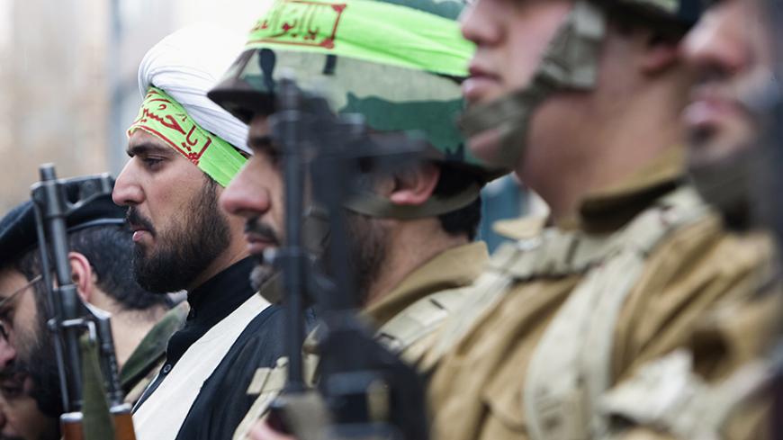 EDITORS' NOTE: Reuters and other foreign media are subject to Iranian restrictions on leaving the office to report, film or take pictures in Tehran.
A cleric, who is member of Iran's Basij militia, attends a military parade to mark Basij week in front of the former U.S. embassy in Tehran November 25, 2011. REUTERS/Raheb Homavandi  (IRAN - Tags: POLITICS MILITARY) - RTR2UG1O