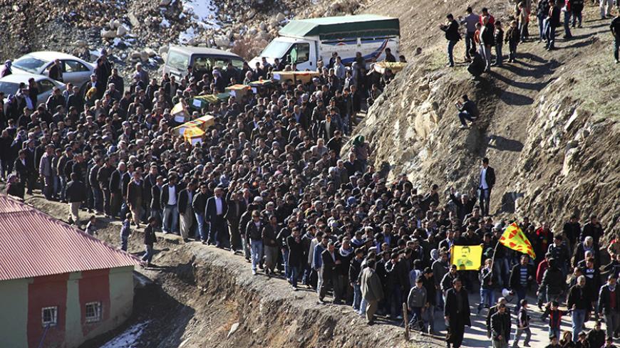 Coffins of victims killed in air strikes are carried by villagers during a funeral ceremony in Gulyazi near the southeastern Turkish town of Uludere, in Sirnak province, December 30, 2011. Turkish rights groups called on Friday for a U.N.-sponsored investigation after Turkish warplanes killed 35 villagers in an airstrike targeting Kurdish rebels on the Iraqi border that the government has called an operational mistake. REUTERS/Stringer (TURKEY - Tags: POLITICS) - RTR2VQMB