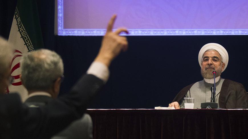 Iran's President Hassan Rouhani takes a question during a news conference on the sidelines of the 69th United Nations General Assembly at United Nations Headquarters in New York September 26, 2014. Rouhani said on Friday "courageous decisions" must be made to clinch a long-term nuclear agreement and that any deal without the lifting of all sanctions against Tehran was "unacceptable".  REUTERS/Adrees Latif   (UNITED STATES - Tags: POLITICS) - RTR47VPF