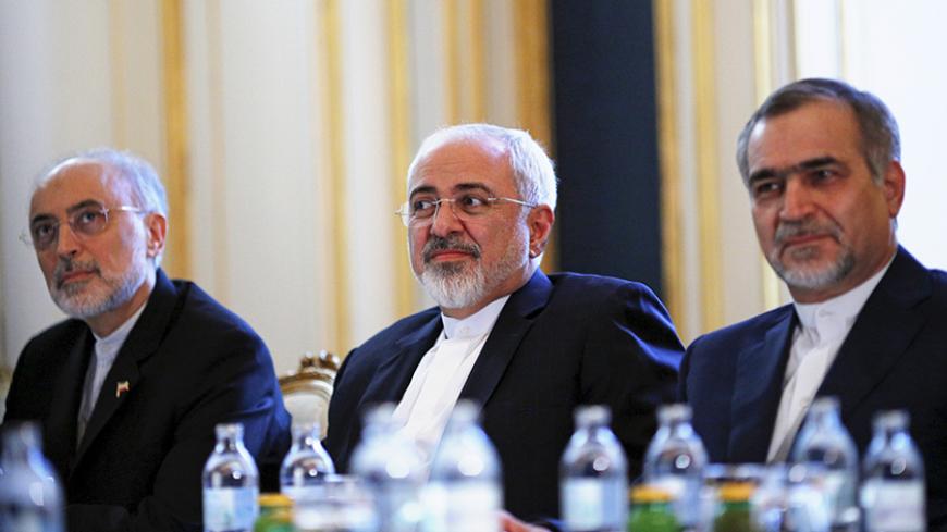 Iranian Foreign Minister Mohammad Javad Zarif (C), Head of the Iranian Atomic Energy Organization Ali Akbar Salehi and Hossein Fereydoon (R), brother and close aide to President Hassan Rouhani meet with U.S. Secretary of State John Kerry (not pictured) at a hotel in Vienna, Austria July 3, 2015. A year and half of nuclear talks between Iran and major powers were creeping towards the finish line on Friday as negotiators wrestled with sticking points including questions about Tehran's past atomic research. R