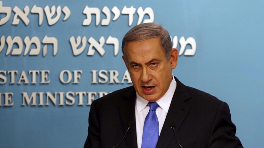 Israel's Prime Minister Benjamin Netanyahu speaks during a news conference in Jerusalem July 14, 2015. Netanyahu said on Tuesday Israel would not be bound by the nuclear deal between world powers and Iran and would defend itself. REUTERS/Ammar Awad - RTX1KA98