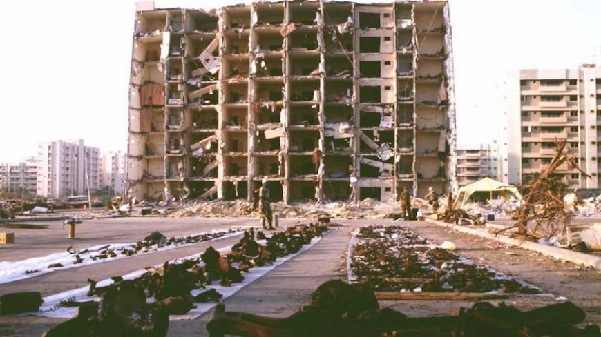 DHAHRAN, SAUDI ARABIA - JULY 2:  US and Saudi officials spread debris 29 June on plastic sheets as they continue to gather evidence in the 25 June bombing outside the Khobar Towers complex in Dhahran, Saudi Arabia.  The explosion killed 19 and injured some 260. AFP PHOTO  (Photo credit should read AFP/AFP/Getty Images)