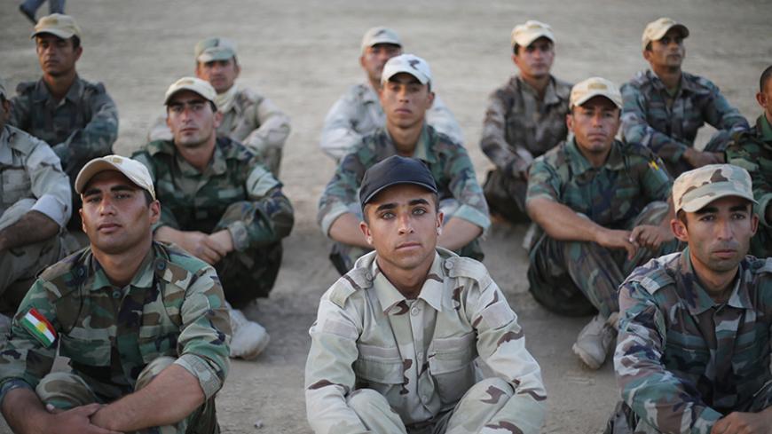 Kurdish Peshmerga fighters are pictured during training before deploying to fight the Islamic State, at a temporary military camp near the front line in Gwar, northern Iraq September 22, 2014. REUTERS/Ahmed Jadallah (IRAQ - Tags: CIVIL UNREST CONFLICT) - RTR479TU