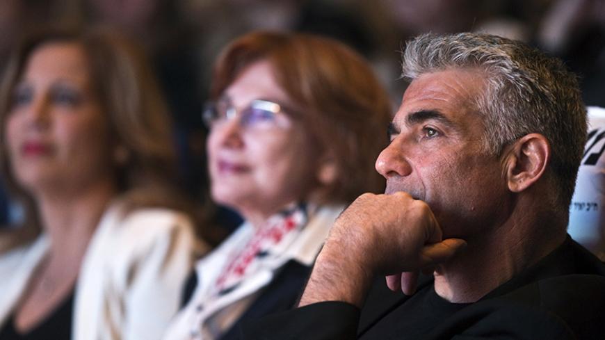 Yesh Atid leader Yair Lapid attends a women's committee convention in Tel Aviv March 1, 2015. The era of Prime Minister Benjamin Netanyahu is ending, with Israeli voters clearly more concerned about economic and social issues than about security or fears over Iran, a leading election candidate said on Monday. Lapid, a telegenic former news anchor and TV host, leads the centrist, secular Yesh Atid party ("There's a Future"), which emerged out of the cost-of-living protests that swept Israel in 2011. Picture