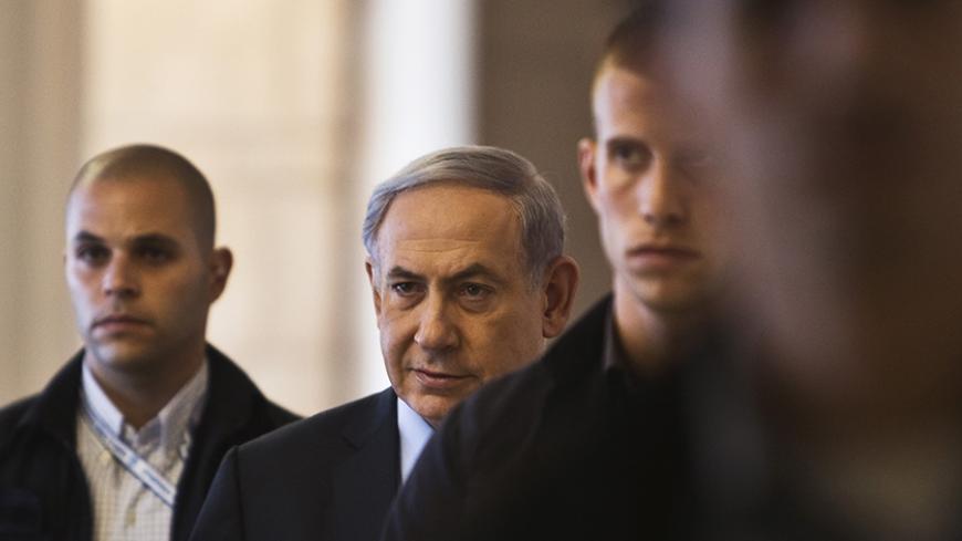 Israel's Prime Minister Benjamin Netanyahu (2nd L) arrives for a Likud party meeting at parliament in Jerusalem July 20, 2015. REUTERS/Nir Elias - RTX1L1RF