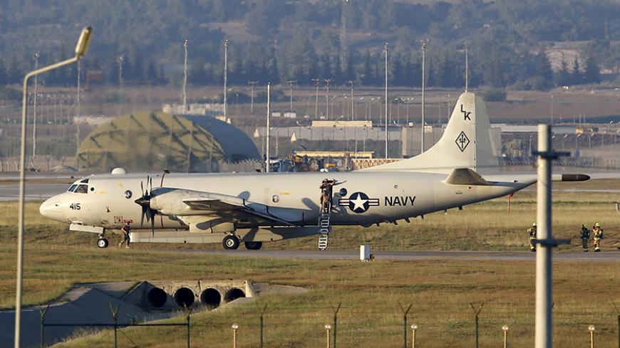Crew members leave from a U.S. Navy P-3 Orion Maritime patrol aircraft after it landed at Incirlik airbase in the southern city of Adana, Turkey, July 25, 2015. REUTERS/Murad Sezer - RTX1LSLM
