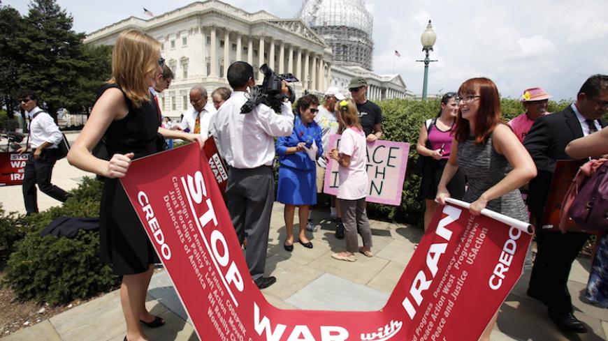 Activists prepare to leave after delivering more than 400,000 petition signatures to Capitol Hill in support of the Iran nuclear deal in Washington July 29, 2015. Secretary of State John Kerry intensified efforts on Tuesday to beat back criticism of the Iran nuclear deal and convince U.S. lawmakers that rejecting it would give Tehran a fast track to a weapon and access to billions of dollars from collapsed sanctions.   REUTERS/Yuri Gripas - RTX1MAT0