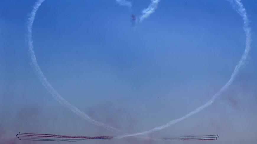 Egyptian air force planes trace a heart during the inauguration ceremony of the new Suez Canal, in Ismailia, Egypt, August 6, 2015. Egypt staged a show of international support on Thursday as it inaugurated a major extension of the Suez Canal which President Abdel Fattah al-Sisi hopes will power an economic turnaround in the Arab world's most populous country. REUTERS/Amr Abdallah Dalsh TPX IMAGES OF THE DAY - RTX1NCFA